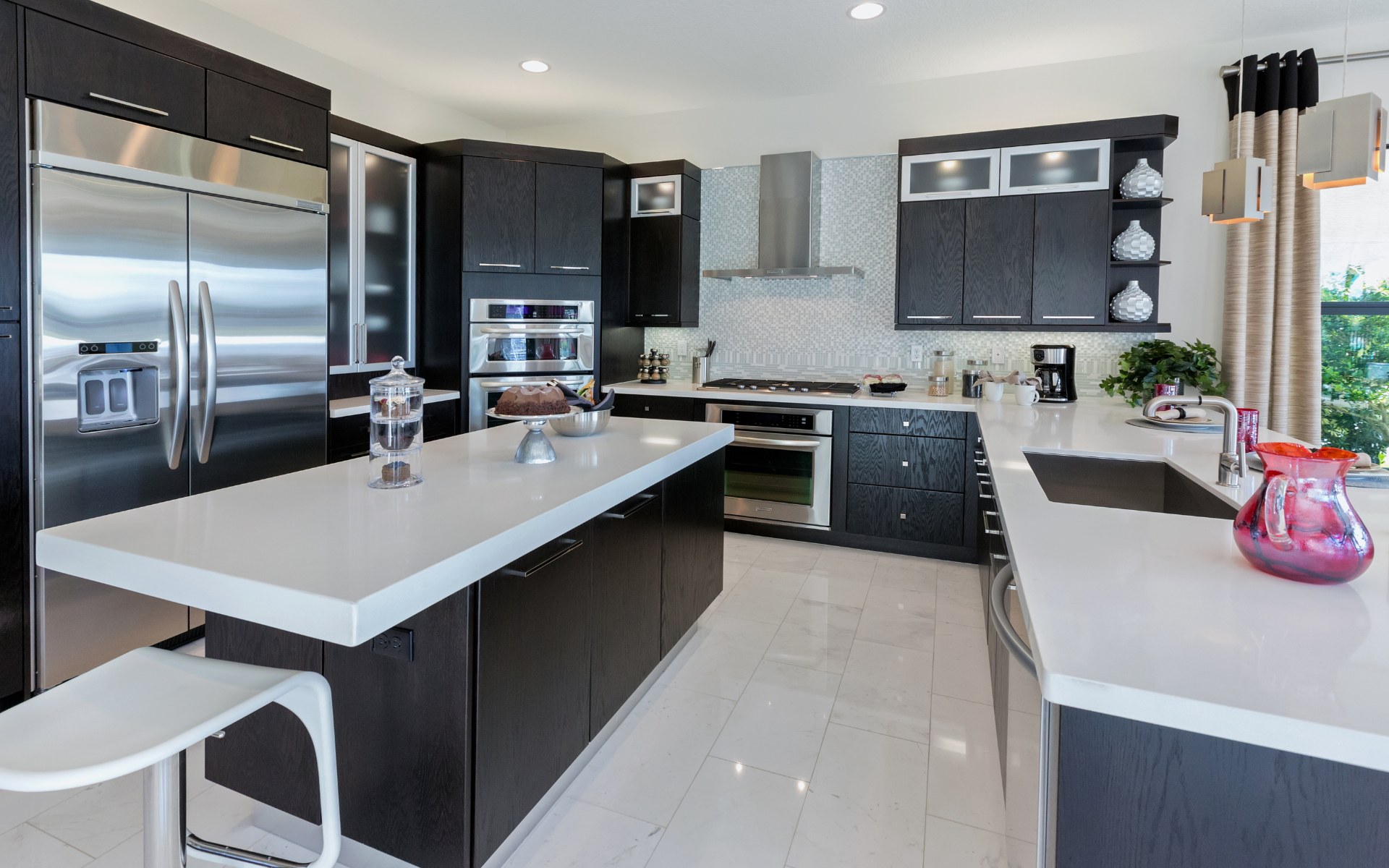 Modern style kitchen with dark brown cabinets and white quartz tops