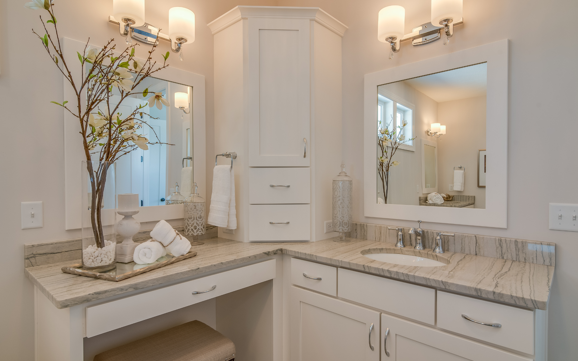 Corner style bathroom vanity with white cabinets