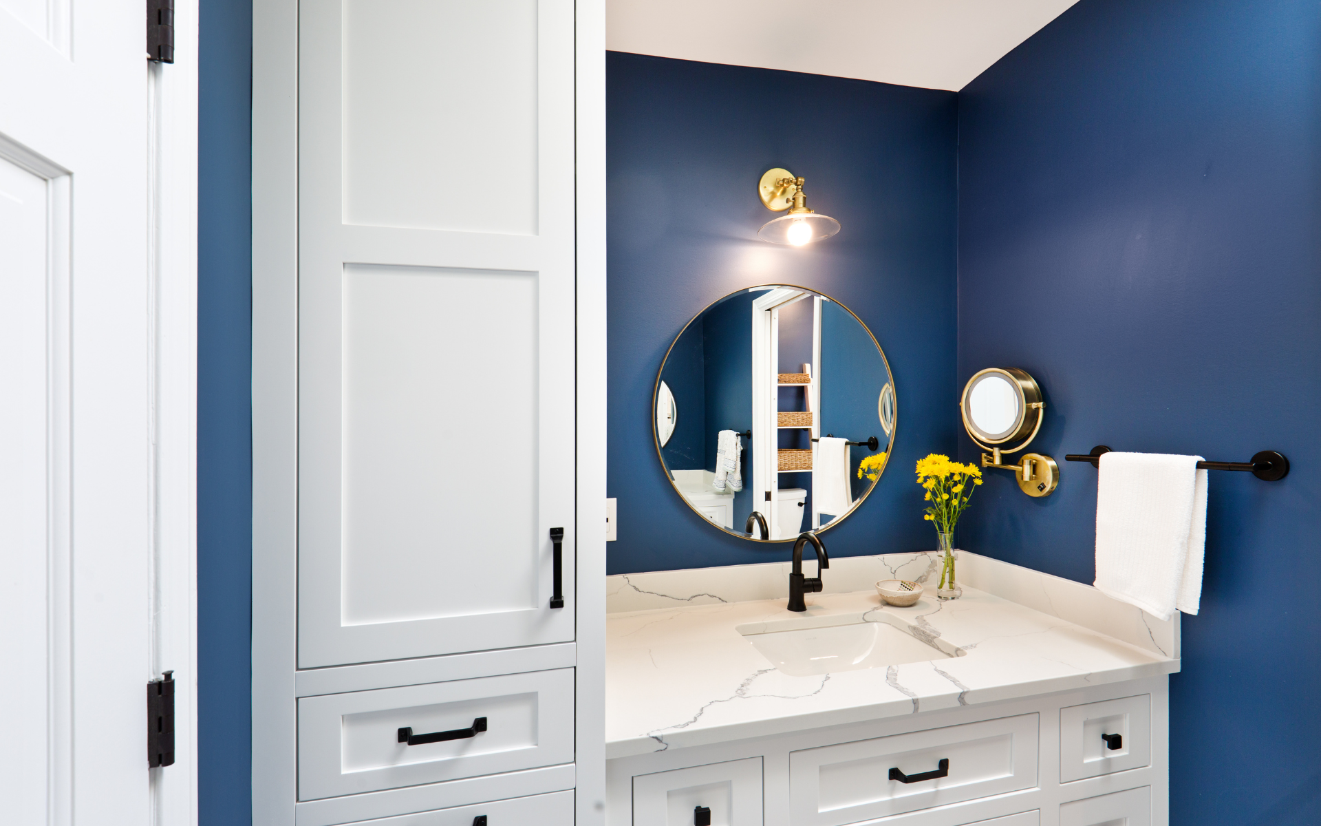 Modern, small blue bathroom with white vanity